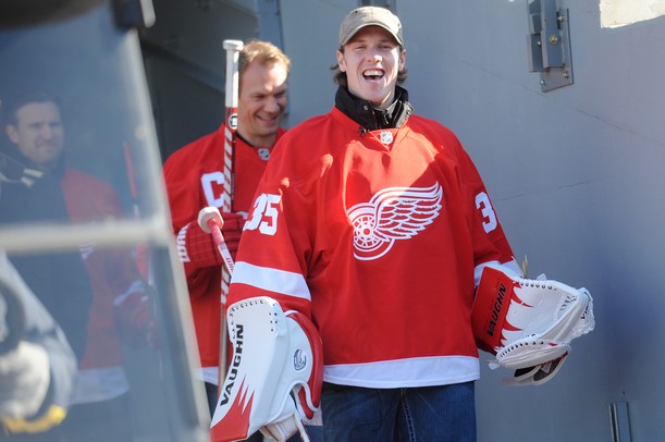 Red Wings goaltender Jimmy Howard smiles as he exits the tunnel and makes his way onto the field at Michigan Stadium for a press conference announcing the 2013 Winter Classic on Thursday afternoon. Melanie Maxwell I AnnArbor.com